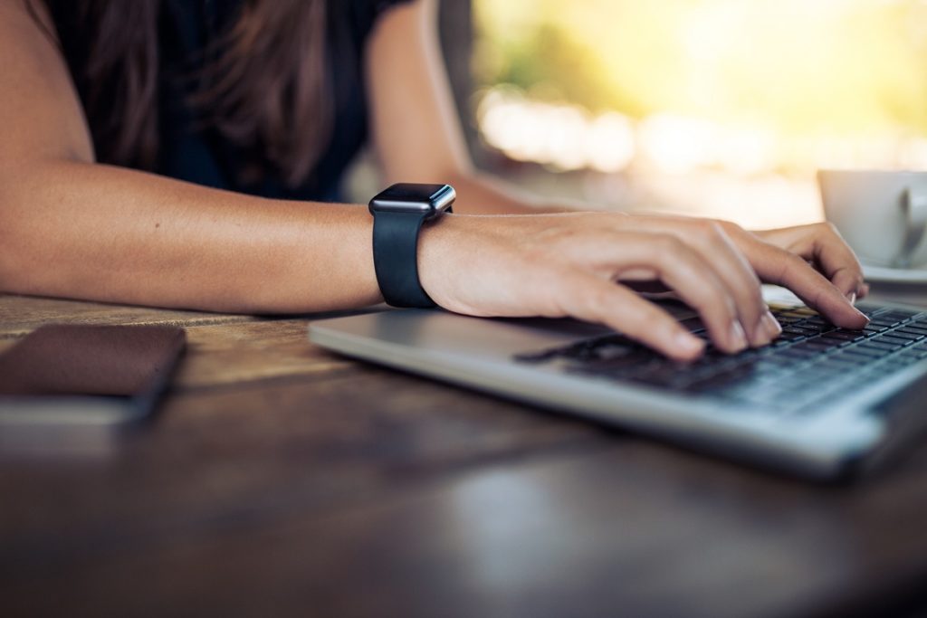Typing on laptop while wearing a wrist gadget