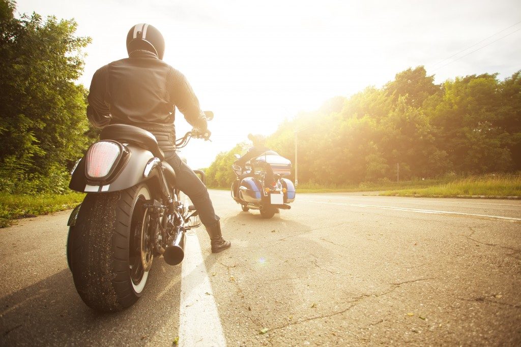 two bikers riding motorcycle in the highway