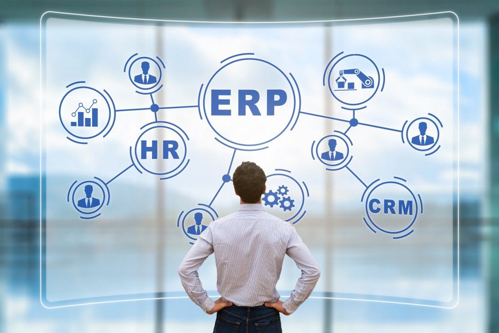 ERP icons viewed by business man