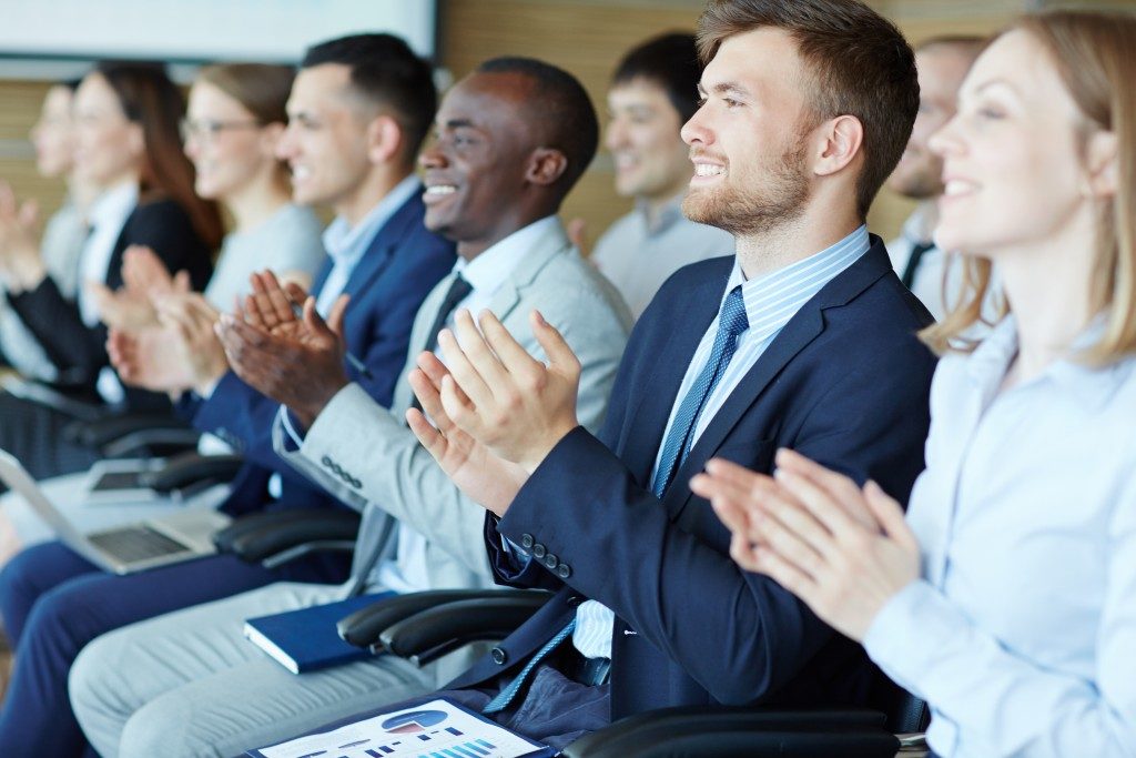businesspeople clapping their hands
