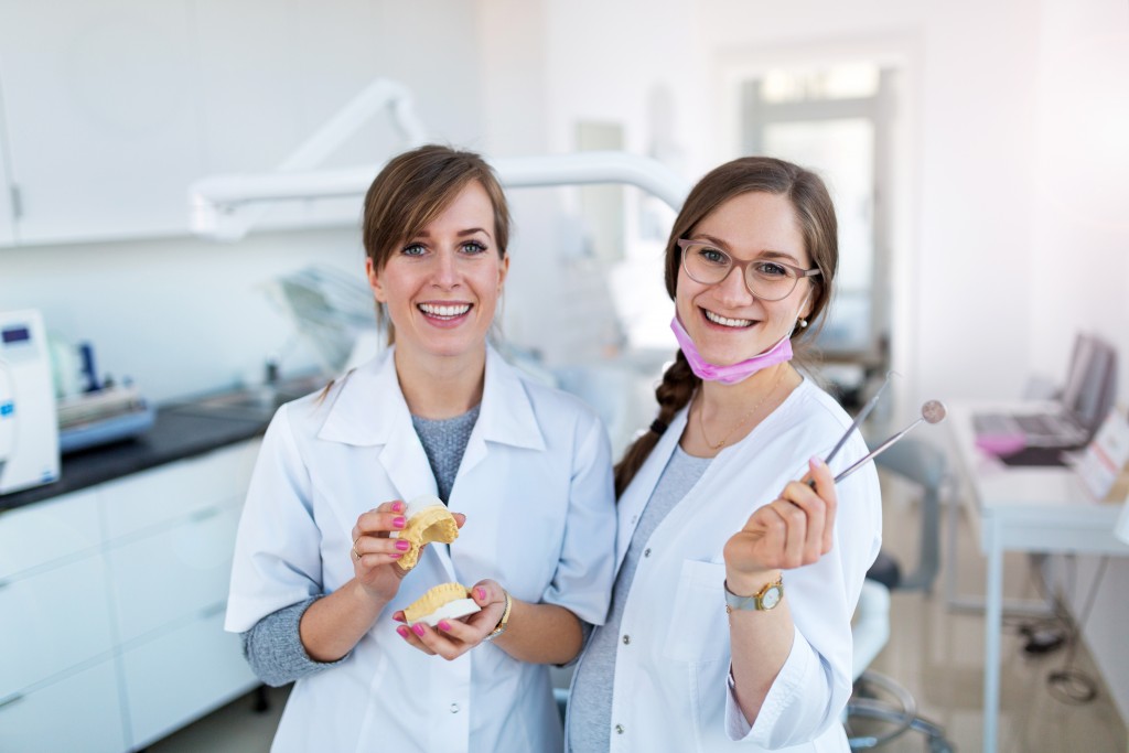 happy dentists in clinic