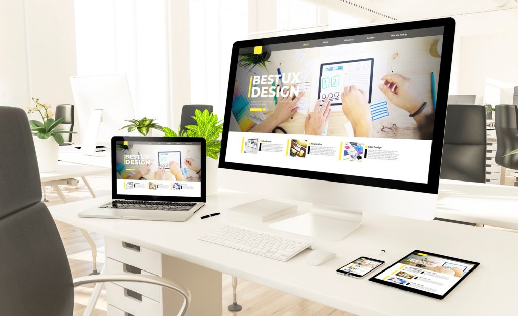 images of a website in different responsive specifications such as laptops, mobile, tablet and desktop computer