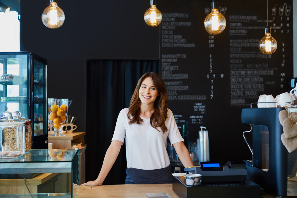 Female business owner behind the cashier