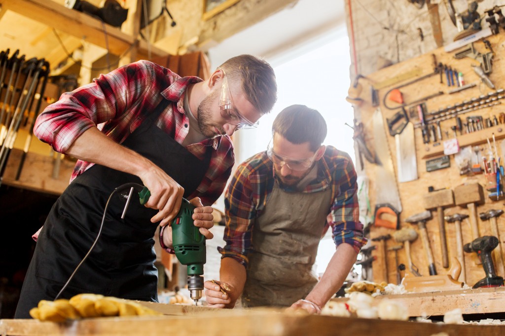 Carpenters wearing protective glasses