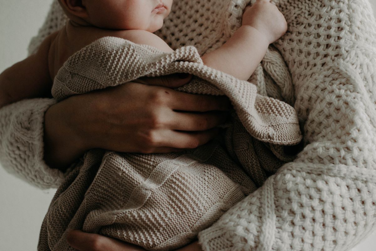 woman holding her baby