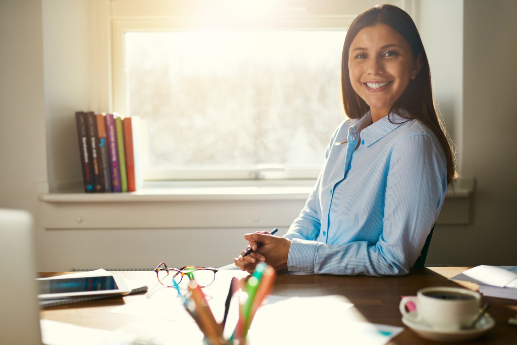 professional sitting in her work area