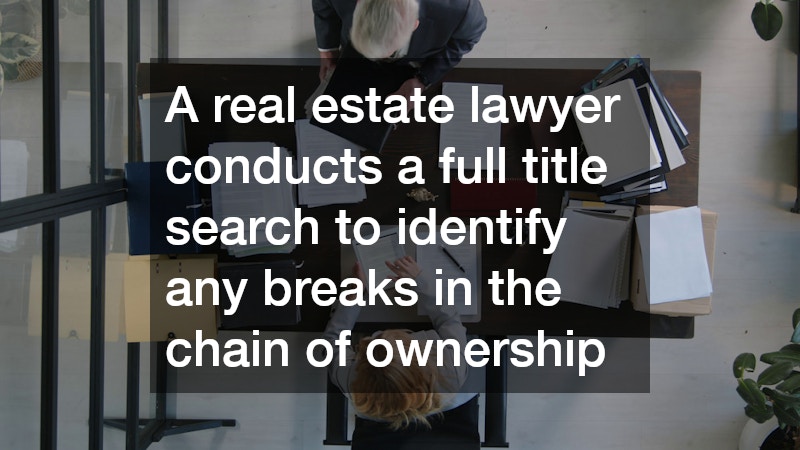 aerial view of two people working at a desk overloaded with legal documents